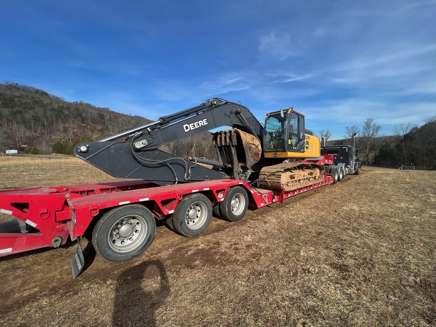 John Deere excavator loaded on an ETG lowboy trailer