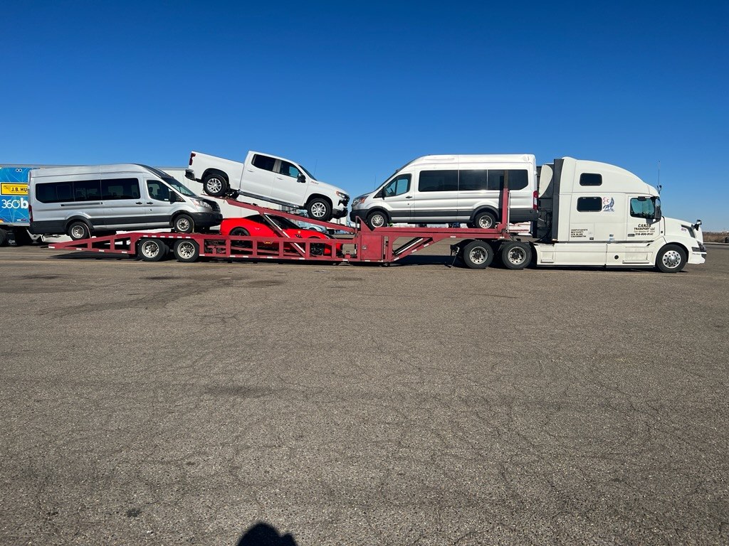 Vans and pickups loaded on an ETG car hauler